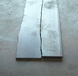 up bow in leveled steel sheets
